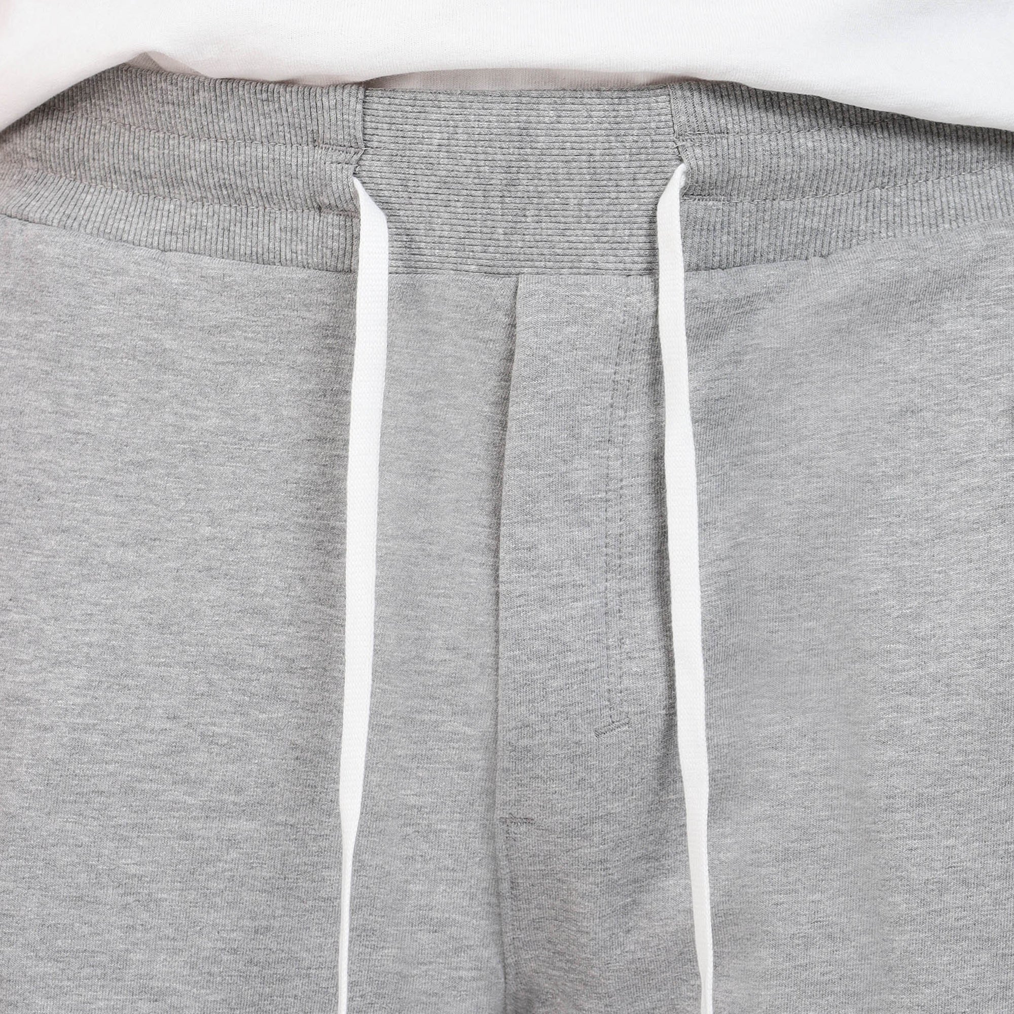 Brethe Free Form Jogger in Heather Grey close-up showing ribbed waistband and drawstrings.