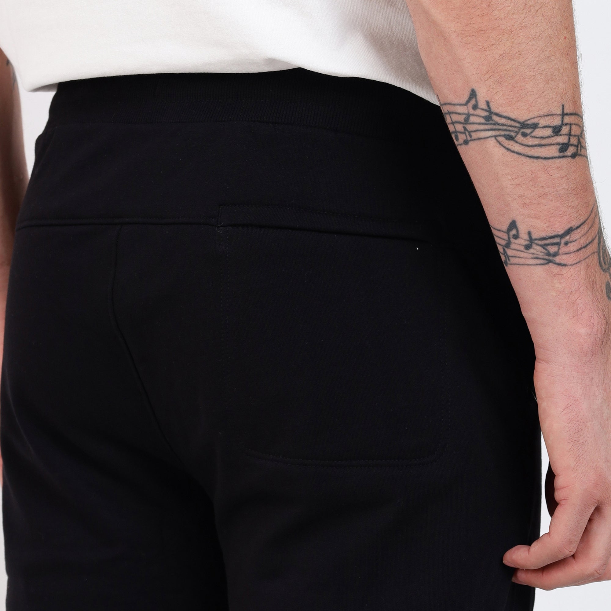 Brethe Soft structured pant in Black back view close-up showing yoke and back pocket.